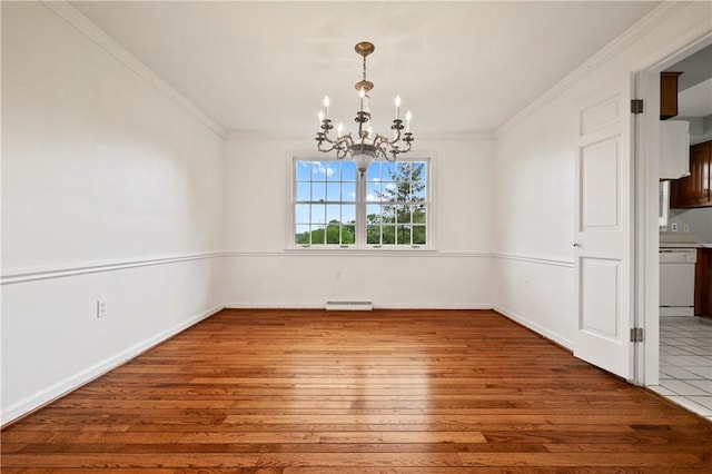 677 Harrogate Rd, Upper St Clair, PA 15241 - unfurnished dining area featuring a chandelier, hardwood / wood-style flooring, ornamental molding, and baseboards