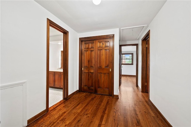 677 Harrogate Rd, Upper St Clair, PA 15241 - hallway with attic access, dark wood finished floors, and baseboards