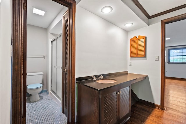 677 Harrogate Rd, Upper St Clair, PA 15241 - bathroom with toilet, a stall shower, baseboards, vanity, and ornamental molding