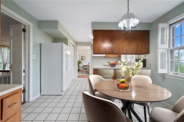677 Harrogate Rd, Upper St Clair, PA 15241 - dining space featuring a chandelier, light tile patterned floors, healthy amount of natural light, and baseboards