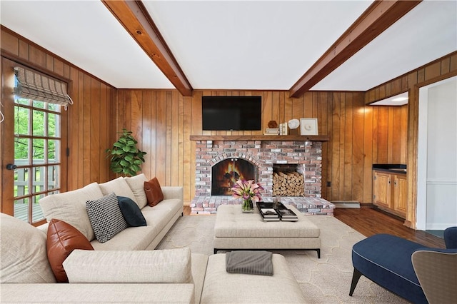677 Harrogate Rd, Upper St Clair, PA 15241 - living room featuring beamed ceiling, wood finished floors, wood walls, baseboard heating, and a fireplace