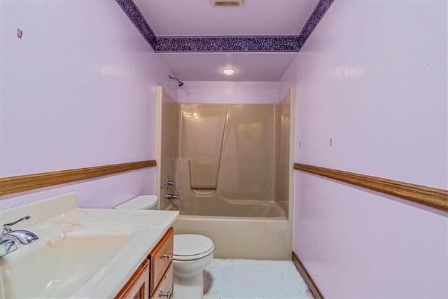 bathroom featuring toilet,  shower combination, and vanity