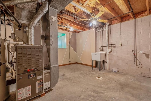 unfinished below grade area featuring heating unit and a sink