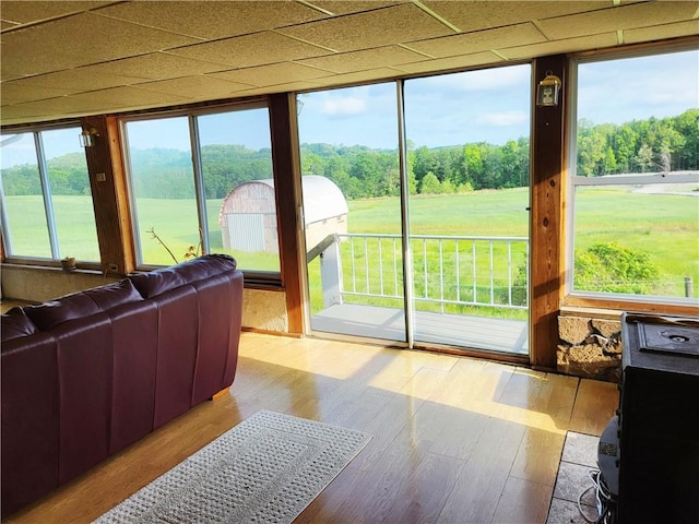 sunroom featuring wood finished floors