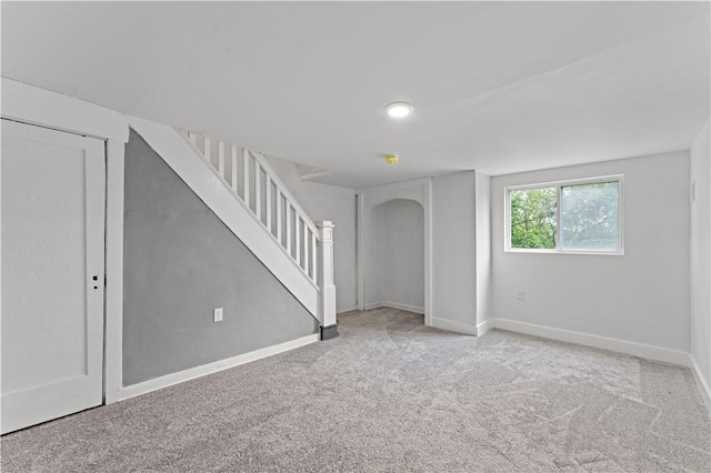 23 Saint Thomas St, South Side, PA 15203 - unfurnished room featuring arched walkways, stairs, carpet floors, and baseboards