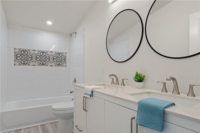 23 Saint Thomas St, South Side, PA 15203 - full bathroom featuring double vanity, toilet, shower / tub combination, recessed lighting, and wood finished floors