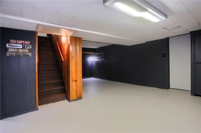 finished basement featuring stairs