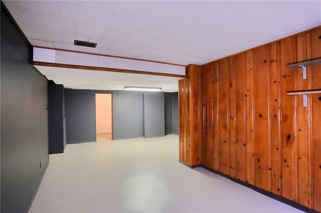 finished below grade area with wood walls