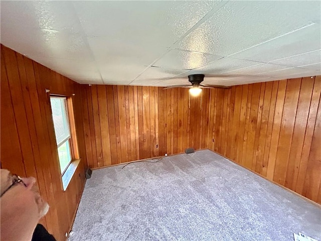 402 Vine St, South Connellsville, PA 15425 - spare room with carpet floors, a ceiling fan, and wooden walls