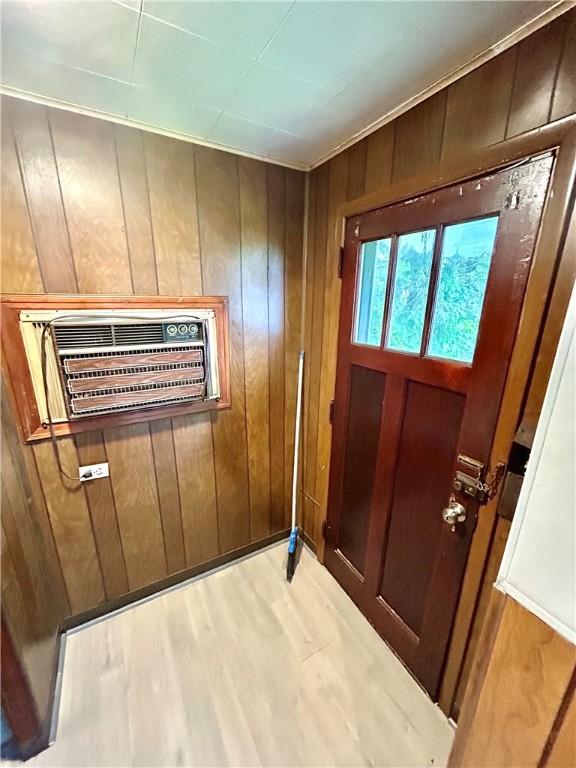 402 Vine St, South Connellsville, PA 15425 - doorway to outside featuring wood walls and wood finished floors