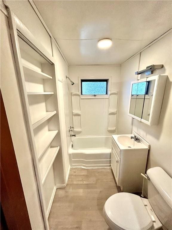 402 Vine St, South Connellsville, PA 15425 - bathroom featuring toilet,  shower combination, wood finished floors, and vanity