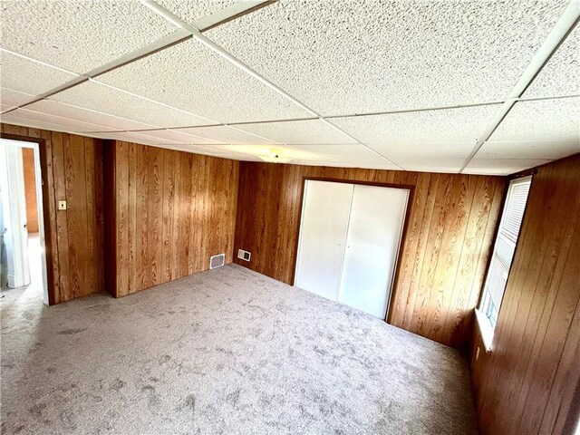402 Vine St, South Connellsville, PA 15425 - carpeted spare room featuring wood walls and a paneled ceiling