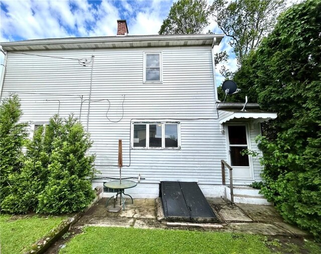 402 Vine St, South Connellsville, PA 15425 - back of house with a chimney