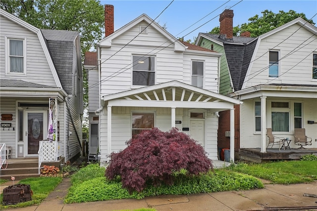 3316 Alberta St, Munhall, PA 15120 - colonial inspired home featuring a porch, a gambrel roof, a shingled roof, and a chimney