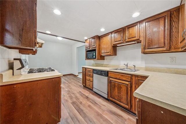 161 Reaghard Dr, West Deer, PA 15024 - kitchen with dishwasher, a sink, black microwave, range with gas cooktop, and light wood-style flooring
