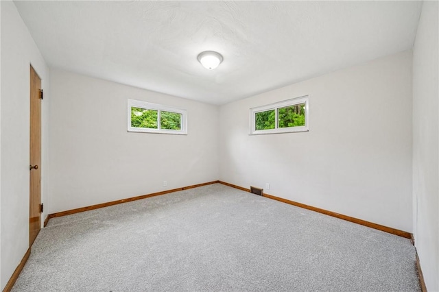 161 Reaghard Dr, West Deer, PA 15024 - spare room with healthy amount of natural light, carpet floors, and baseboards