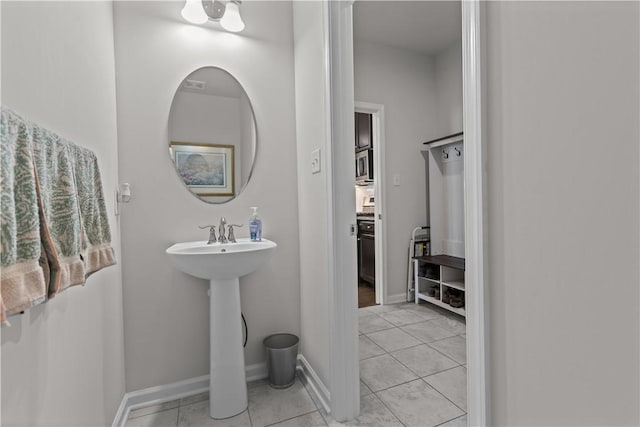bathroom featuring tile patterned floors and baseboards