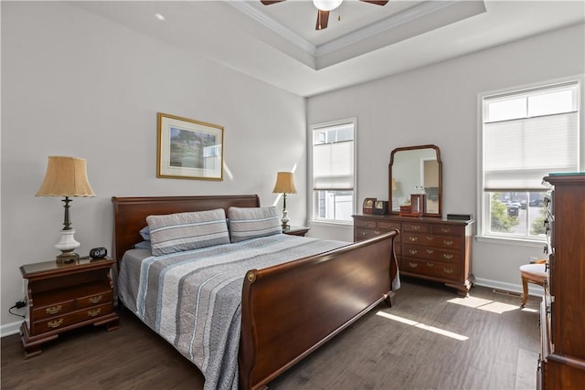 bedroom with dark wood-type flooring, multiple windows, crown molding, and baseboards
