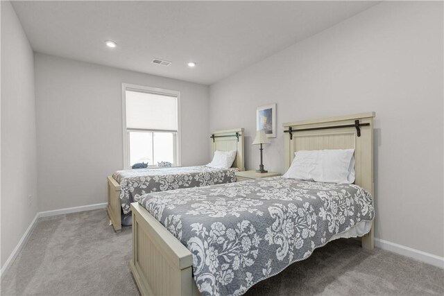 carpeted bedroom with baseboards and recessed lighting