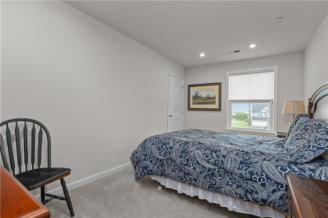 carpeted bedroom featuring recessed lighting and baseboards