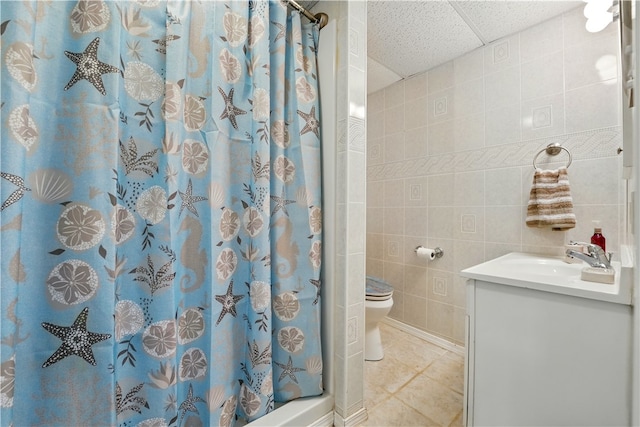 1702 Carlisle St, New Castle/2Nd, PA 16105 - full bathroom featuring vanity, a stall shower, toilet, tile patterned floors, and tile walls