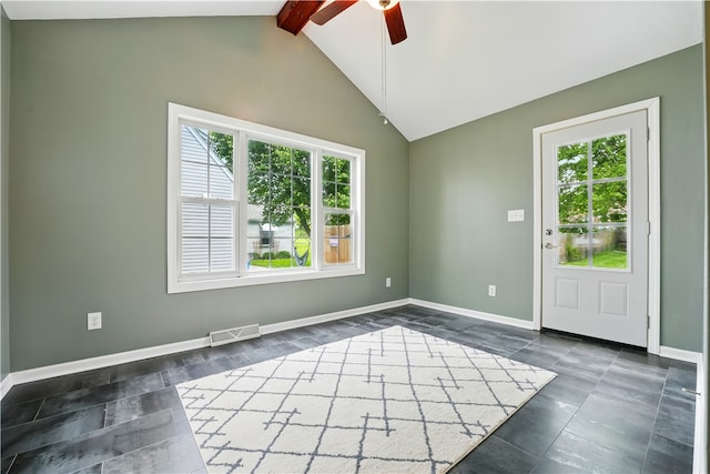 empty room with a ceiling fan, healthy amount of natural light, and baseboards