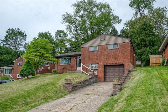 815 Londonderry Dr, Castle Shannon, PA 15234 - tri-level home featuring a garage, concrete driveway, brick siding, and a front yard