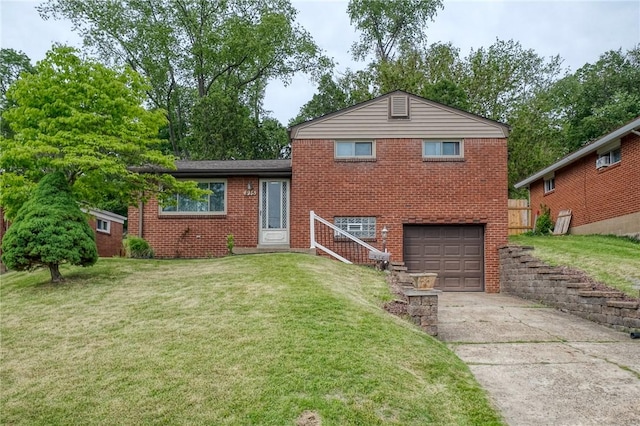 815 Londonderry Dr, Castle Shannon, PA 15234 - split level home with a garage, driveway, brick siding, and a front yard