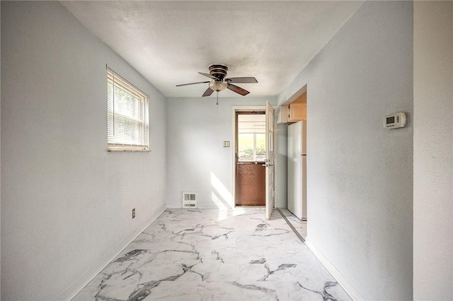 815 Londonderry Dr, Castle Shannon, PA 15234 - spare room with baseboards, light marble finish flooring, and a ceiling fan