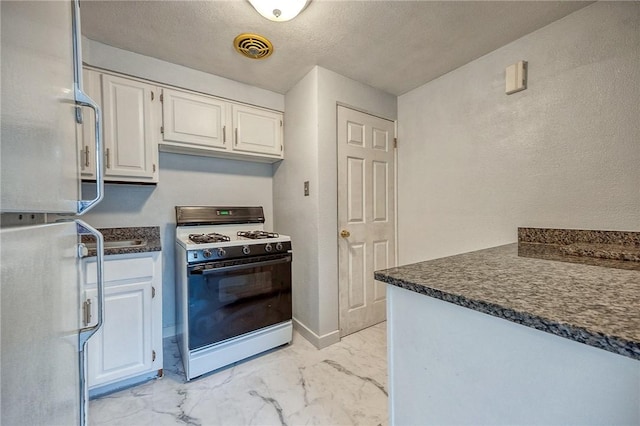815 Londonderry Dr, Castle Shannon, PA 15234 - kitchen with white appliances, dark countertops, light marble finish flooring, white cabinets, and a textured ceiling