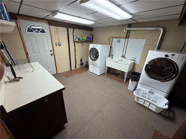 321 Crest Ave, Rostraver, PA 15012 - laundry room featuring concrete block wall and washer and dryer
