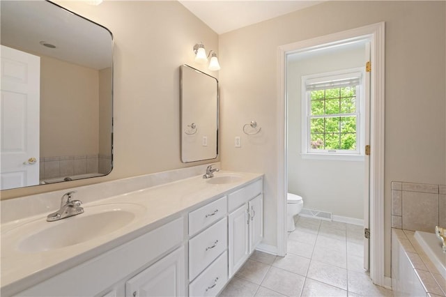 815 Kira Cir, Cranberry Twp, PA 16066 - bathroom with double vanity, toilet, a garden tub, tile patterned floors, and baseboards