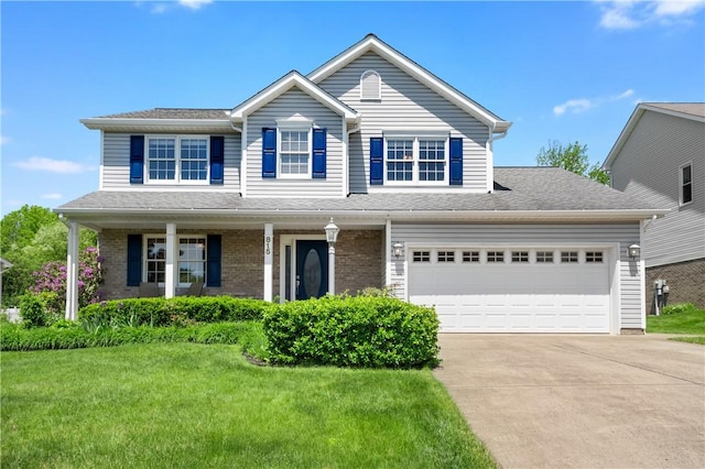 815 Kira Cir, Cranberry Twp, PA 16066 - traditional-style home with concrete driveway, a front lawn, covered porch, and brick siding