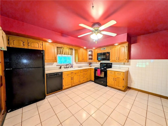 160 Frye Farm Rd, Unity Twp, PA 15601 - kitchen with black appliances, a sink, light countertops, a ceiling fan, and tile walls