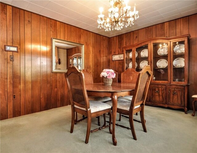 24 N St, Smith, PA 15004 - dining room featuring light carpet, wood walls, and a chandelier