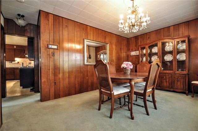 24 N St, Smith, PA 15004 - dining room featuring light colored carpet, a chandelier, and wood walls