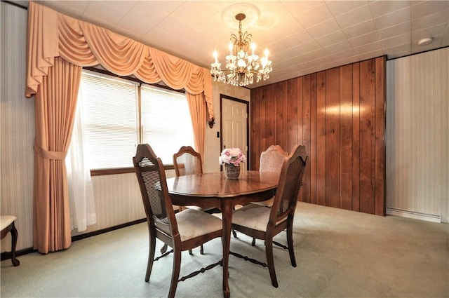 24 N St, Smith, PA 15004 - dining room featuring light colored carpet, a chandelier, wood walls, and wallpapered walls