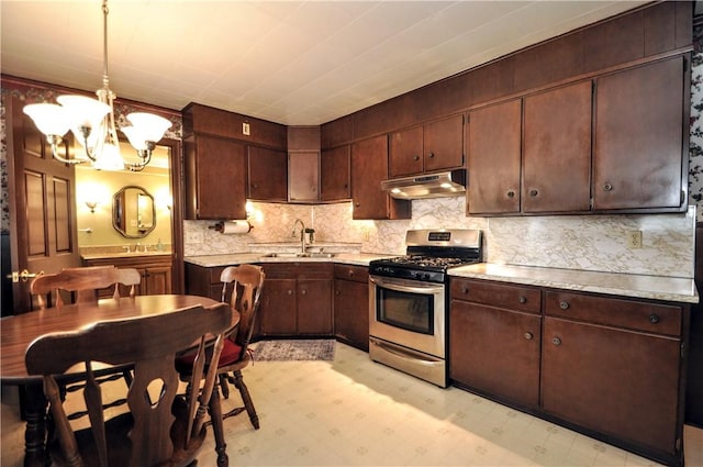 24 N St, Smith, PA 15004 - kitchen with stainless steel range with gas stovetop, a sink, under cabinet range hood, light countertops, and light floors