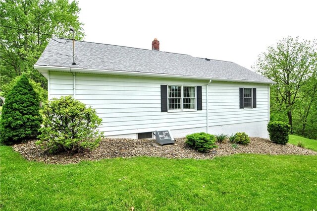24 N St, Smith, PA 15004 - view of side of home featuring a yard, a chimney, and a shingled roof