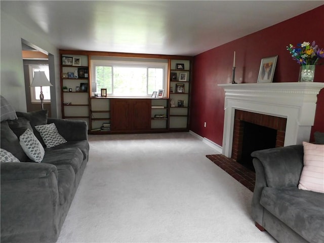 living room featuring light carpet, a fireplace, and baseboards