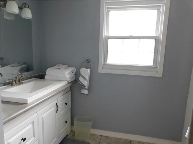 bathroom featuring baseboards and vanity