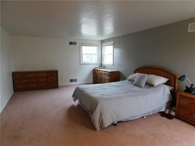 bedroom with light colored carpet