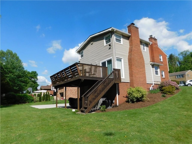 back of house with a deck, a lawn, a chimney, and stairway