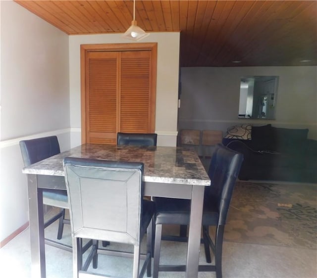 dining area featuring wood ceiling