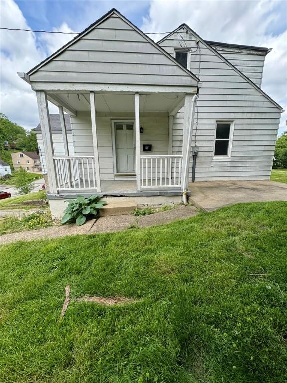 95 Adams Dr, Upper St Clair, PA 15241 - view of front of house with a front yard and a porch