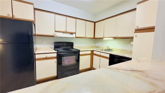 1987 Centurion Dr Unit 107, Forest Hills Boro, PA 15221 - kitchen with black appliances, under cabinet range hood, a sink, light stone counters, and white cabinets