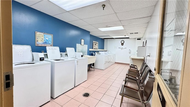 1987 Centurion Dr Unit 107, Forest Hills Boro, PA 15221 - community laundry room with washing machine and dryer and light tile patterned floors