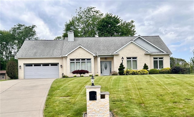 view of front of property featuring brick siding, an attached garage, driveway, and a front yard