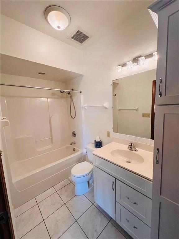 full bathroom with vanity, toilet, shower / tub combination, and tile patterned floors