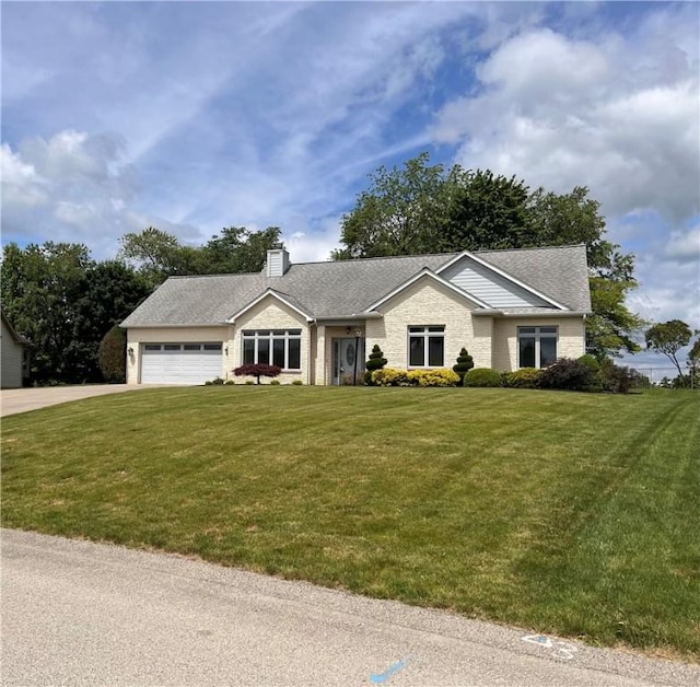 ranch-style house featuring a garage, a front lawn, concrete driveway, and a chimney